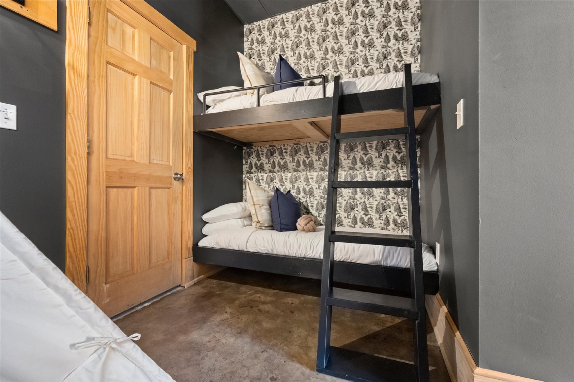 Lower Level Bunk Room — Sasquatch wallpaper and twin bunk beds